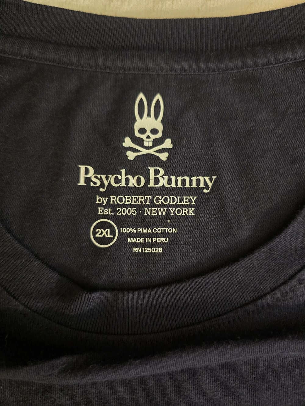 Psycho Bunny Black Tee with Multicolor Striped Bunny Skull